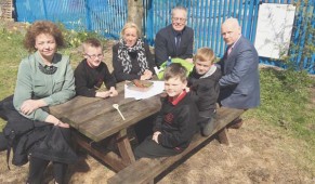 CAPACTIVE LEARNING: Culture Minister Carál Ní Chuilín and Gerry Kelly from Sinn Féin with classroom assistant Sharon Cairns, pupils Shea Maguire, Ryan O'Neill and Caiden Stewart and Principal Kevin McArevey at Holy Cross Boys School